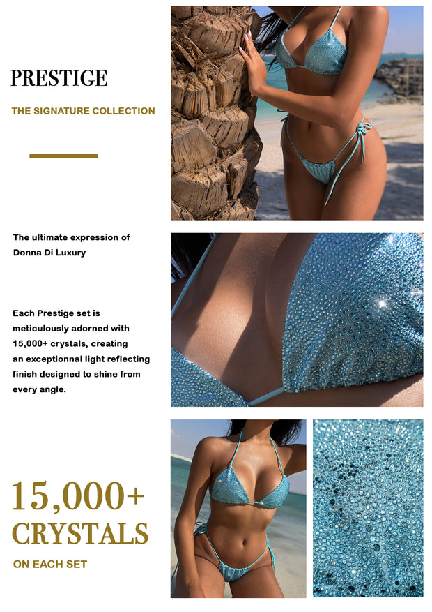 Donna Di Luxury press kit page for the Prestige Signature Collection, featuring a Aquamarine crystal-embellished bikini on a beach with palm trees, close-up detail shots of the crystal embellishment swimwear, and text noting each set is adorned with over 15,000 crystals.